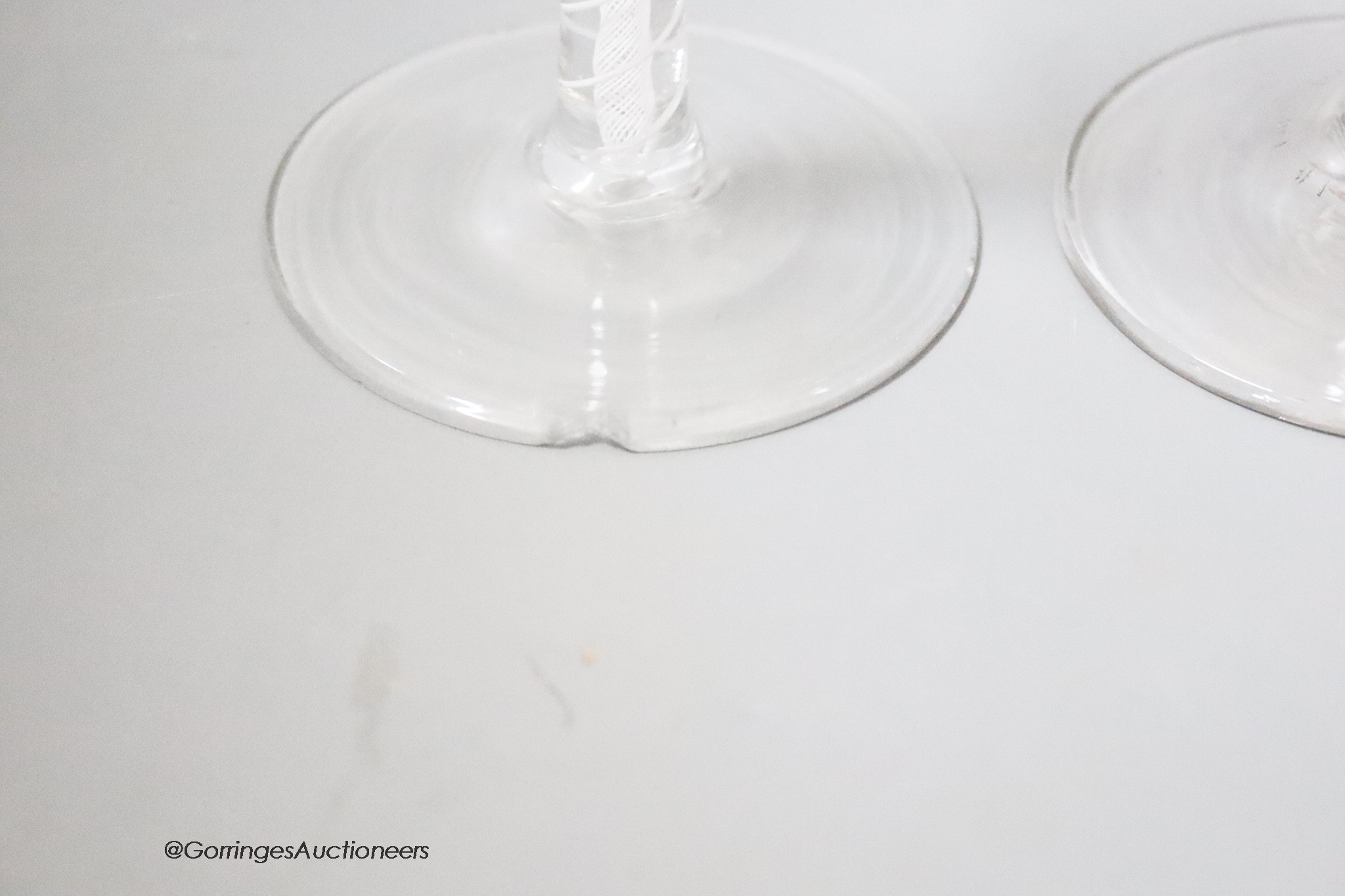 Two 18th century cotton twist stemmed wine glasses, tallest 15.5cm, one wth a rim chip